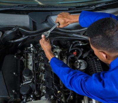 Mechanic servicing a car at repair garage